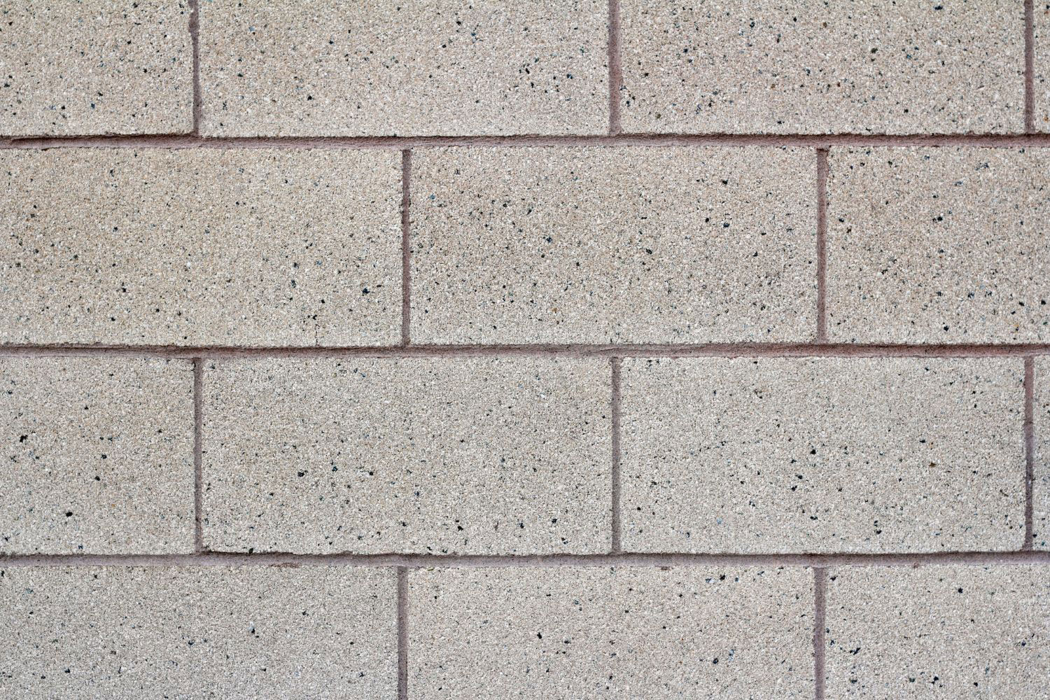 Close-up of a concrete block foundation wall with clean mortar joints and no visible cracks or damage.